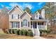 Well-maintained home with a charming porch and manicured landscaping at 127 Hyde Way, Dallas, GA 30157