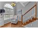 Open foyer with high ceilings, large window and a cozy chair at 127 Hyde Way, Dallas, GA 30157