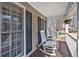 Inviting covered porch with rocking chairs, perfect for relaxing outdoors at 127 Hyde Way, Dallas, GA 30157