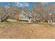 Traditional home in a wooded lot with mature trees and front lawn at 127 Hyde Way, Dallas, GA 30157