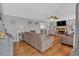 Inviting living room with hardwood floors, a fireplace, and natural light at 127 Hyde Way, Dallas, GA 30157