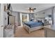 Comfortable main bedroom with neutral walls, a ceiling fan, and large windows for natural light at 127 Hyde Way, Dallas, GA 30157