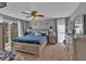 Cozy main bedroom with neutral gray walls, a ceiling fan, and a large bed with plush pillows at 127 Hyde Way, Dallas, GA 30157