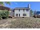 A well-maintained two-story home with a spacious backyard featuring a deck and a covered hot tub at 2697 Links Overlook Drive Dr, Dacula, GA 30019