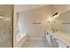 Bathroom featuring a glass shower, separate tub, double sink, and modern fixtures at 2697 Links Overlook Drive Dr, Dacula, GA 30019
