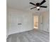 Bedroom features neutral paint, soft carpet, double closets and ceiling fan at 2697 Links Overlook Drive Dr, Dacula, GA 30019