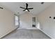 Spacious bedroom featuring neutral paint, soft carpet, vaulted ceiling and a fan at 2697 Links Overlook Drive Dr, Dacula, GA 30019