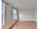 Bedroom boasts gleaming hardwood floors and neutral-colored walls at 2697 Links Overlook Drive Dr, Dacula, GA 30019