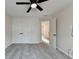 Bedroom features neutral paint, soft carpet, double closets and ceiling fan at 2697 Links Overlook Drive Dr, Dacula, GA 30019
