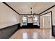 Bright dining room features hardwood floors, chair rail, and elegant chandelier at 2697 Links Overlook Drive Dr, Dacula, GA 30019