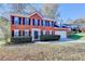 Charming two-story brick home with manicured landscaping and an attached two-car garage at 2697 Links Overlook Drive Dr, Dacula, GA 30019