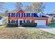 Charming two-story brick home with manicured landscaping and an attached two-car garage at 2697 Links Overlook Drive Dr, Dacula, GA 30019