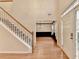 Inviting foyer with hardwood floors, staircase, and views into other living spaces at 2697 Links Overlook Drive Dr, Dacula, GA 30019