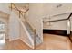 Inviting foyer with hardwood floors, staircase, and views into other living spaces at 2697 Links Overlook Drive Dr, Dacula, GA 30019