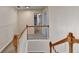 Bright hallway with neutral walls and carpet, classic wood and white railing, and recessed lighting at 2697 Links Overlook Drive Dr, Dacula, GA 30019