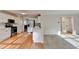 Bright kitchen featuring white cabinets, stainless steel appliances, and hardwood floors at 2697 Links Overlook Drive Dr, Dacula, GA 30019