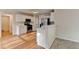Well-lit kitchen with stainless steel appliances, white cabinets, and a breakfast bar at 2697 Links Overlook Drive Dr, Dacula, GA 30019