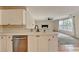 Well-designed kitchen with white cabinetry and modern stainless steel dishwasher appliance at 2697 Links Overlook Drive Dr, Dacula, GA 30019