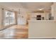 Open kitchen with eat in dining area featuring wood floors and modern appliances at 2697 Links Overlook Drive Dr, Dacula, GA 30019
