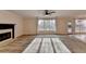 Spacious living room provides a fireplace, carpeted floors, and large windows at 2697 Links Overlook Drive Dr, Dacula, GA 30019