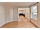 Living room area with hardwood floors leads to dining room and front door at 2697 Links Overlook Drive Dr, Dacula, GA 30019