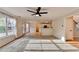 Open-concept living room and kitchen with hardwood floors and natural light at 2697 Links Overlook Drive Dr, Dacula, GA 30019