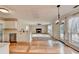 Open floor plan between kitchen and living room with fireplace and natural light at 2697 Links Overlook Drive Dr, Dacula, GA 30019