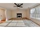Inviting living room featuring carpeted floors and a cozy fireplace at 2697 Links Overlook Drive Dr, Dacula, GA 30019