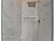 Modern shower featuring white tiles, built-in niche and a rainfall shower head at 2697 Links Overlook Drive Dr, Dacula, GA 30019