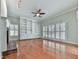 Inviting living room with a cozy fireplace, custom built-ins, plantation shutters, and ample natural light at 4880 Hunters Oaks Ln, Alpharetta, GA 30009