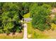 Secluded home with mature trees, a long driveway, and a charming exterior at 5115 Cascade Palmetto Hwy, Fairburn, GA 30213