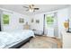 Bright bedroom with hardwood floors, two windows, and neutral paint for a calming retreat at 5115 Cascade Palmetto Hwy, Fairburn, GA 30213