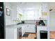 Efficient kitchen features white cabinetry and stainless appliances at 5115 Cascade Palmetto Hwy, Fairburn, GA 30213