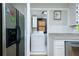 Conveniently located laundry room features a washing machine, dryer, and easy access from the kitchen at 5115 Cascade Palmetto Hwy, Fairburn, GA 30213