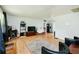 Bright living area features wood floors, fireplace, decor and an open floor plan to the kitchen at 5115 Cascade Palmetto Hwy, Fairburn, GA 30213