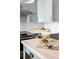 Close up of kitchen featuring mint green cabinets, stainless steel appliances, and butcher block island at 1044 Manigault Se St, Atlanta, GA 30316