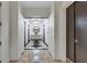 Hallway view with black and white floors, chandelier, mirror, and elevator access at 3040 Peachtree Nw Rd, Atlanta, GA 30305