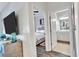Cozy hallway with a view of a well-lit bedroom and a pristine bathroom at 3040 Peachtree Nw Rd, Atlanta, GA 30305