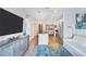 Open-concept living room featuring modern décor, stainless appliances, island and hardwood floors at 3040 Peachtree Nw Rd, Atlanta, GA 30305