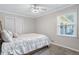 Bright bedroom with neutral walls, carpet, and natural light, with a comfortable full-size bed at 3681 Donavan Ct, Decatur, GA 30034