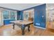 Bright game room with a pool table and natural light, ideal for relaxation and recreation at 3681 Donavan Ct, Decatur, GA 30034