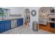 Charming kitchen featuring stainless steel appliances, bright cabinets, and arched doorways at 3681 Donavan Ct, Decatur, GA 30034