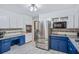 Well-lit kitchen with stainless steel appliances, modern cabinets, and ample counter space at 3681 Donavan Ct, Decatur, GA 30034