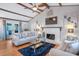 Bright living room with vaulted ceilings, hardwood floors, fireplace, and French doors at 3681 Donavan Ct, Decatur, GA 30034