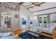 Open-concept living room with wood floors, vaulted ceiling, stylish decor, and adjoining rooms at 3681 Donavan Ct, Decatur, GA 30034