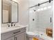 Bathroom featuring a glass-enclosed shower and modern vanity with sleek fixtures at 2063 Windermere Xing, Cumming, GA 30041