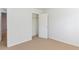 A bright bedroom features neutral carpet, a closet, and white walls, providing a clean and adaptable space at 2496 Gristhaven Ln, Buford, GA 30519