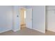 The bedroom shows neutral carpet, and access to an additional room and a closet, offering flexibility and practicality at 2496 Gristhaven Ln, Buford, GA 30519