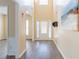 Foyer boasts soaring ceilings, beautiful wood flooring, and a stylish coat rack at 2496 Gristhaven Ln, Buford, GA 30519