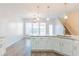 Bright kitchen with granite countertops, stainless steel appliances, and breakfast bar at 2496 Gristhaven Ln, Buford, GA 30519